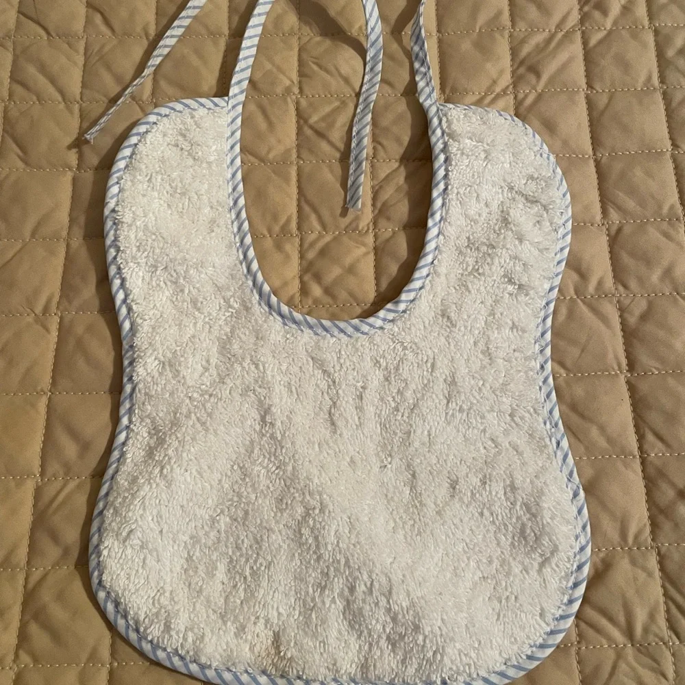 Handmade Bib white with blue trim, tie closure, brand new.